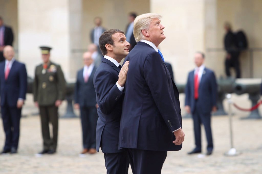 Trump and Macron observe a monument at Bastille Day celebrations in Paris last year